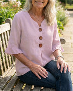 Marina Roca Blusa Inés de algodón-lino lisa con botones de madera y volantes – photo 12